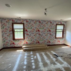 We added some decorative wallpaper to this residential home's bedroom. Here's the finished product of the wallpaper around the windows and wall.